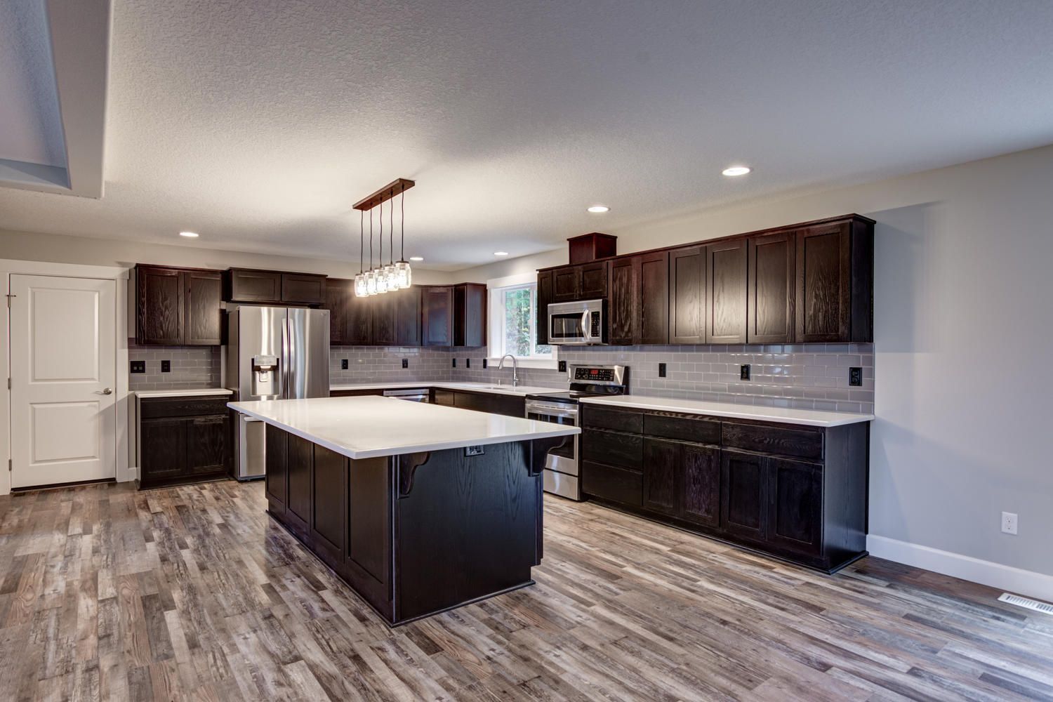 There is a large island in the middle of the kitchen.