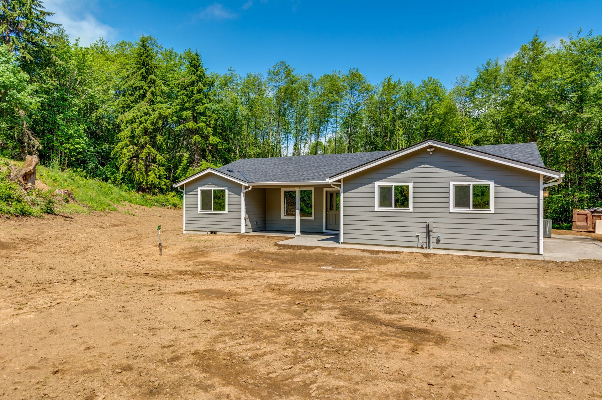 A house with a lot of dirt in front of it