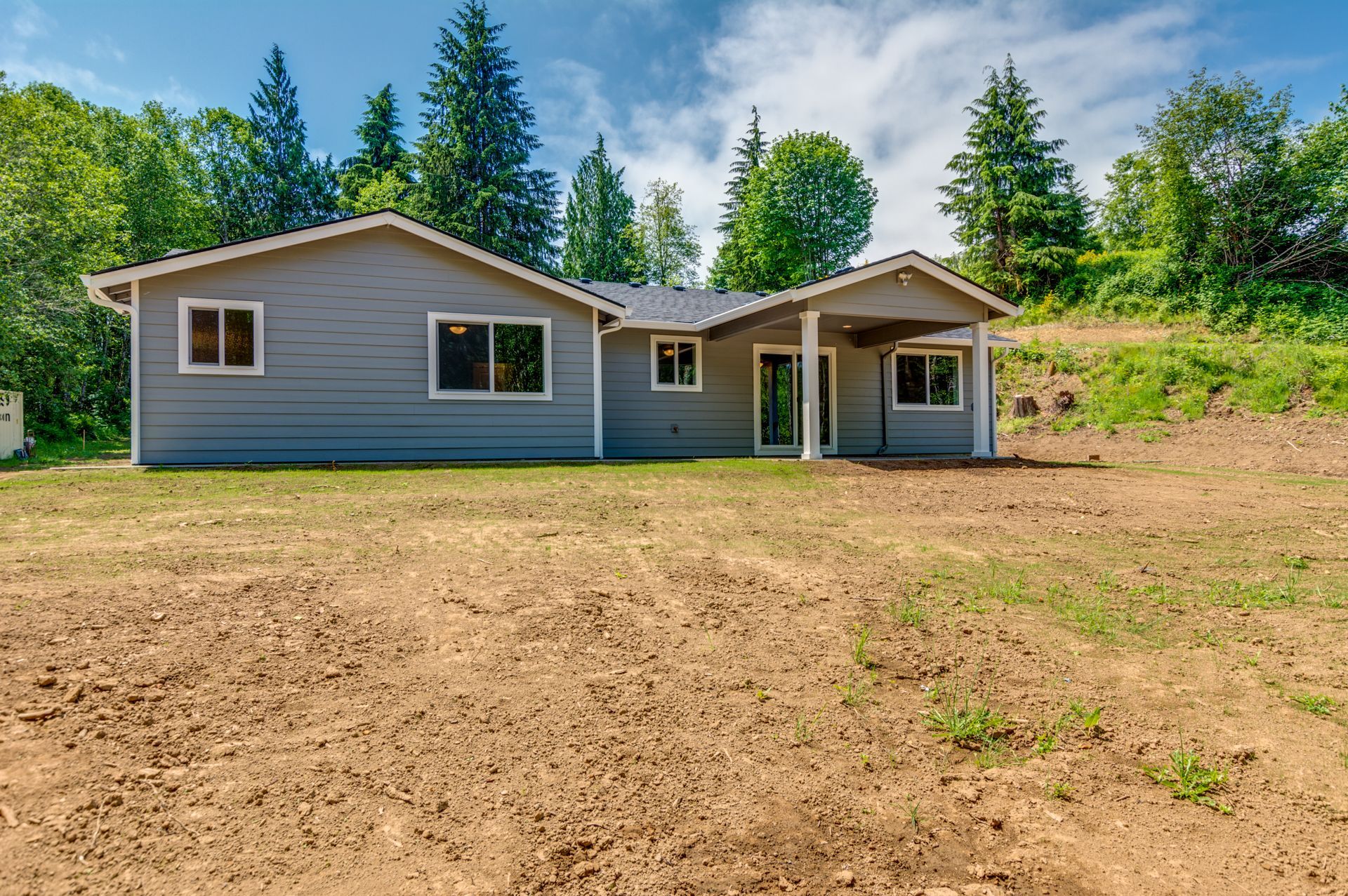 A house with a lot of dirt in front of it