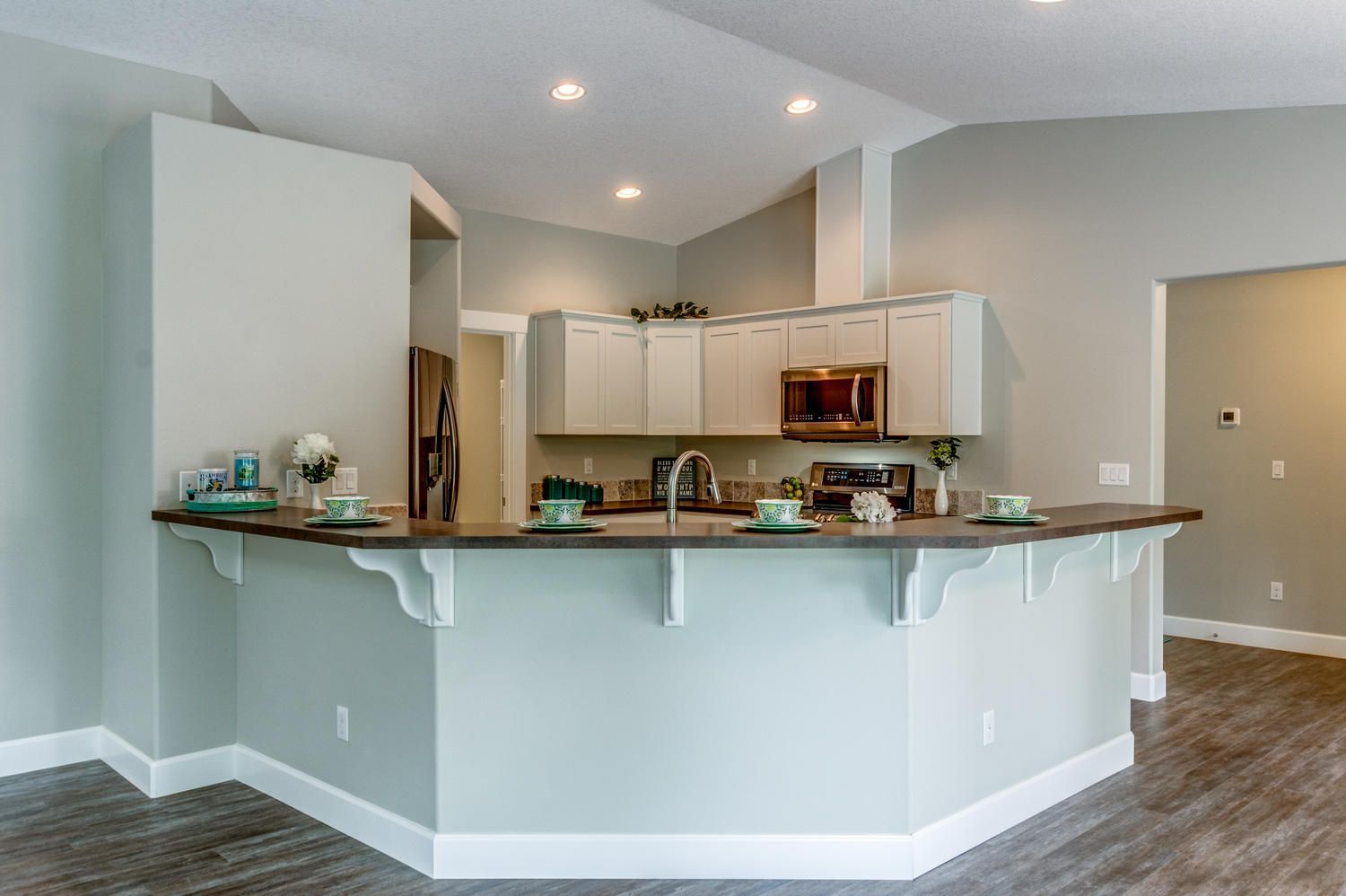 A kitchen with a large island in the middle of the room.