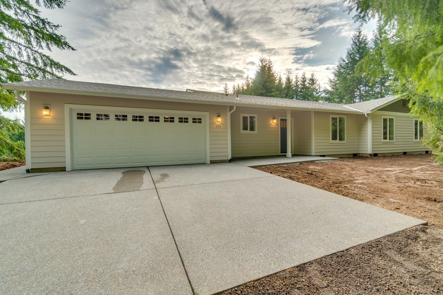 The front of a house with a garage and a driveway