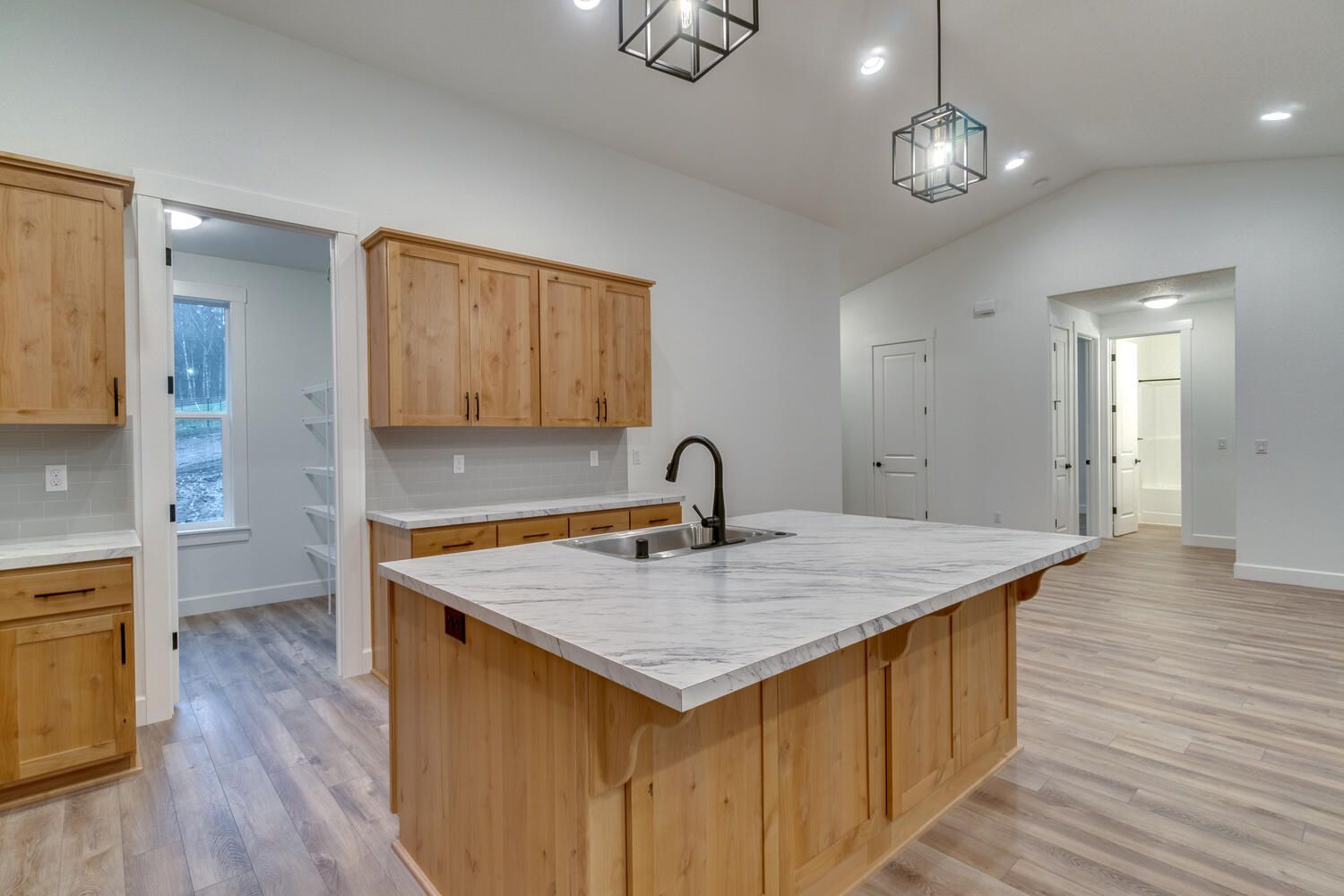 There is a large island in the middle of the kitchen.