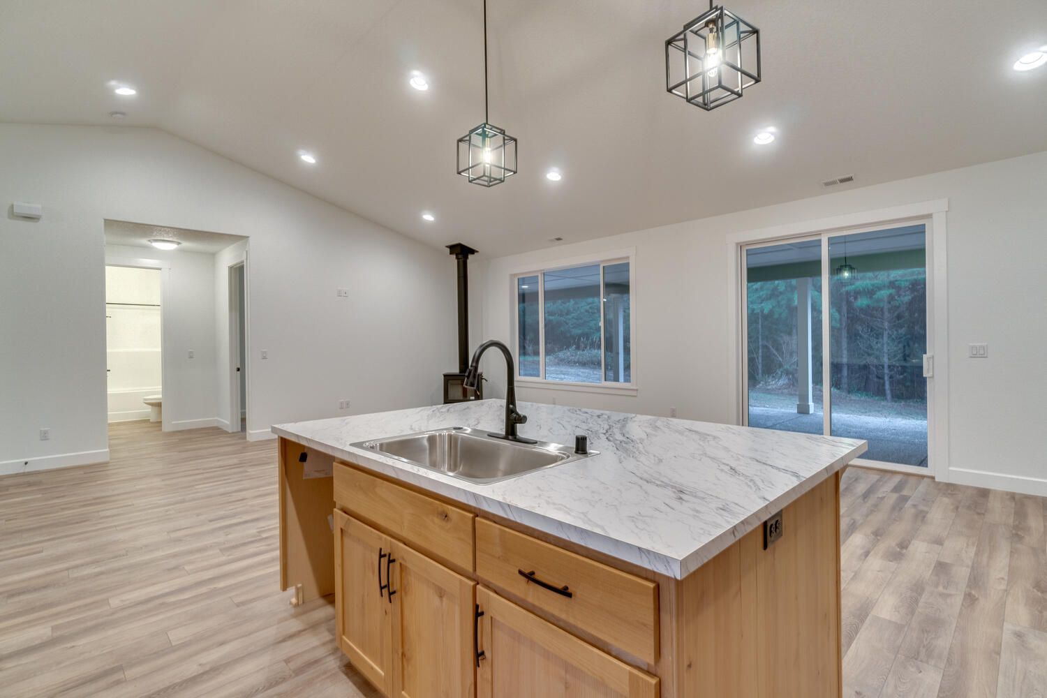 There is a large island in the middle of the kitchen.