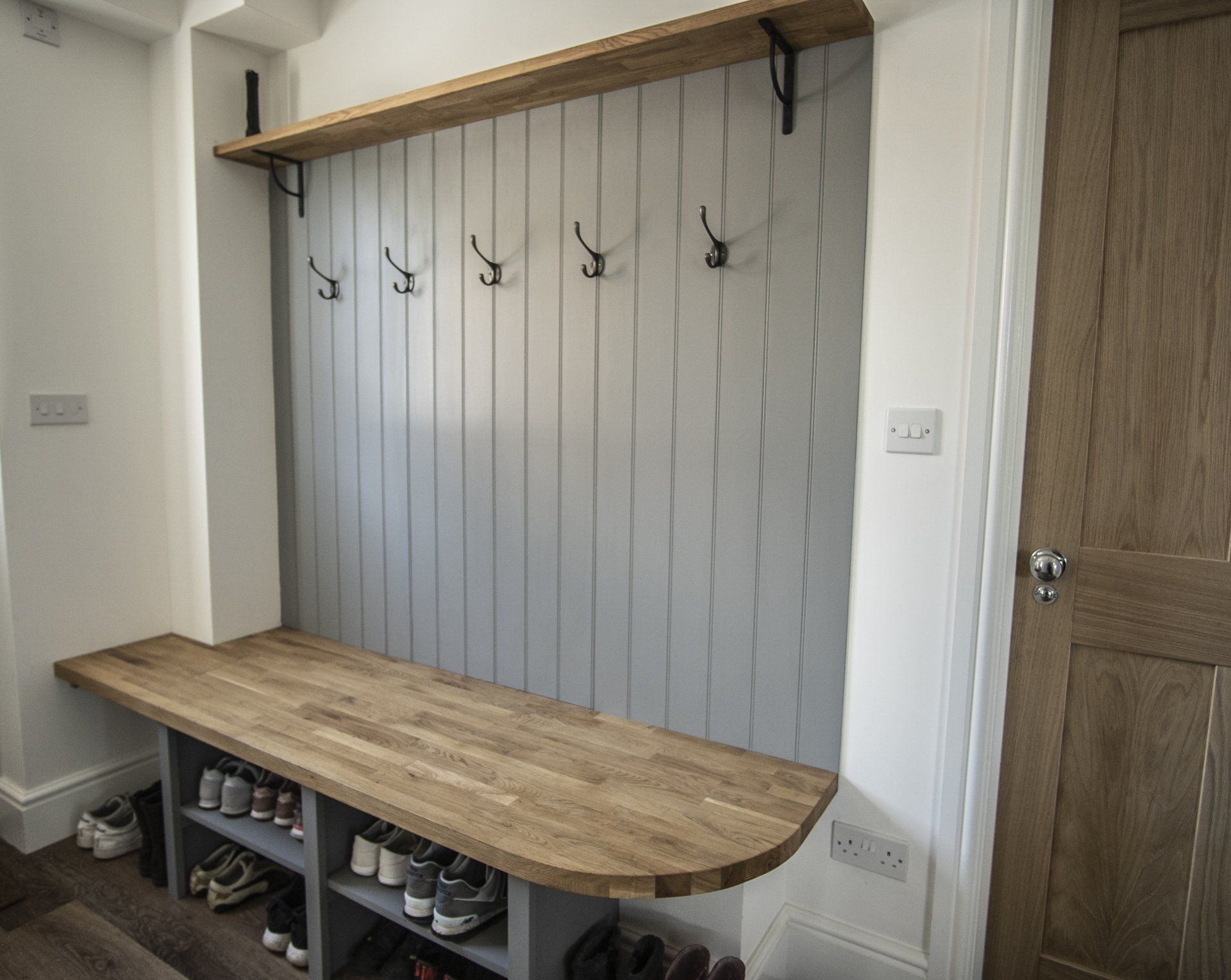 coat hook area with bench