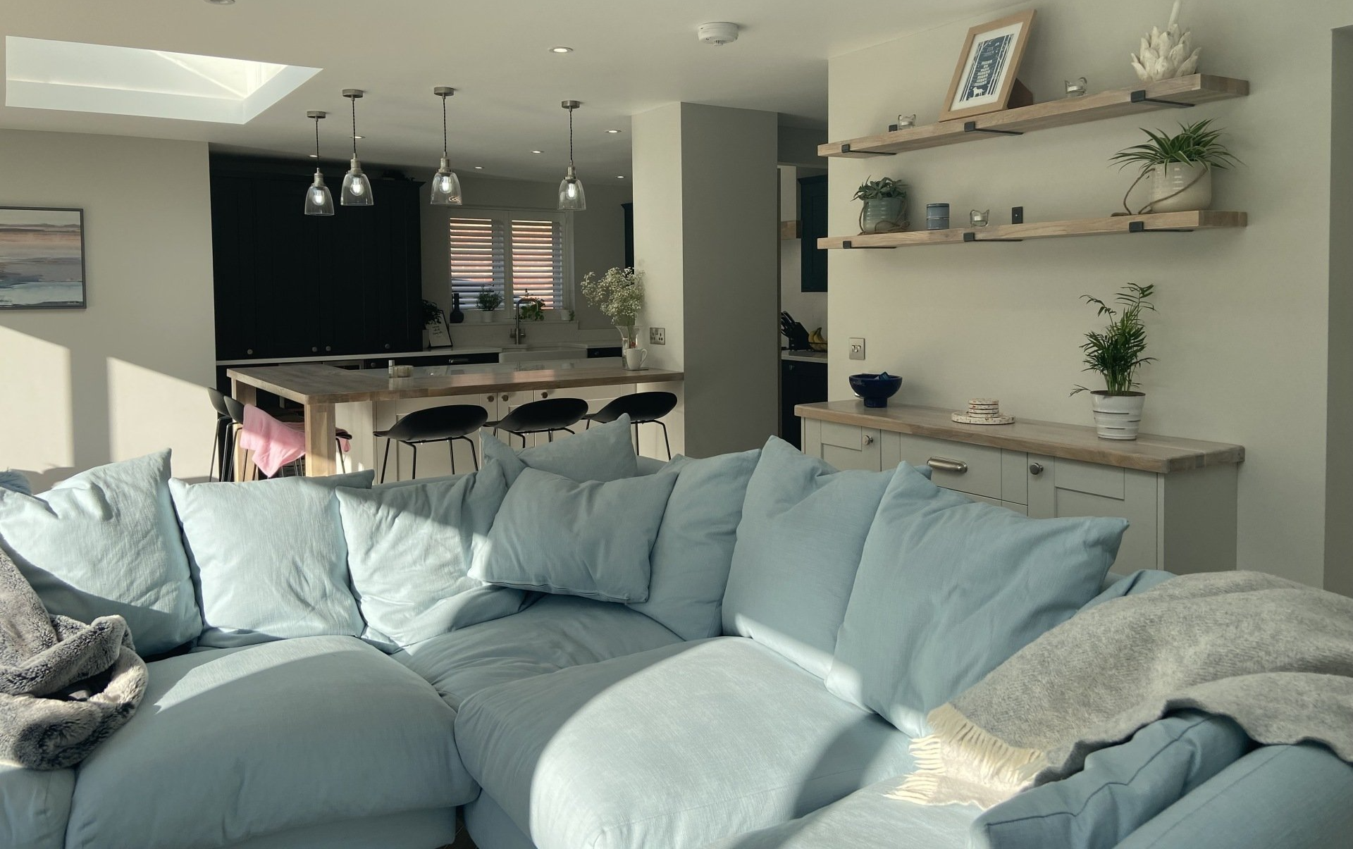 baby blue cushioned sofa in Skandi style living area