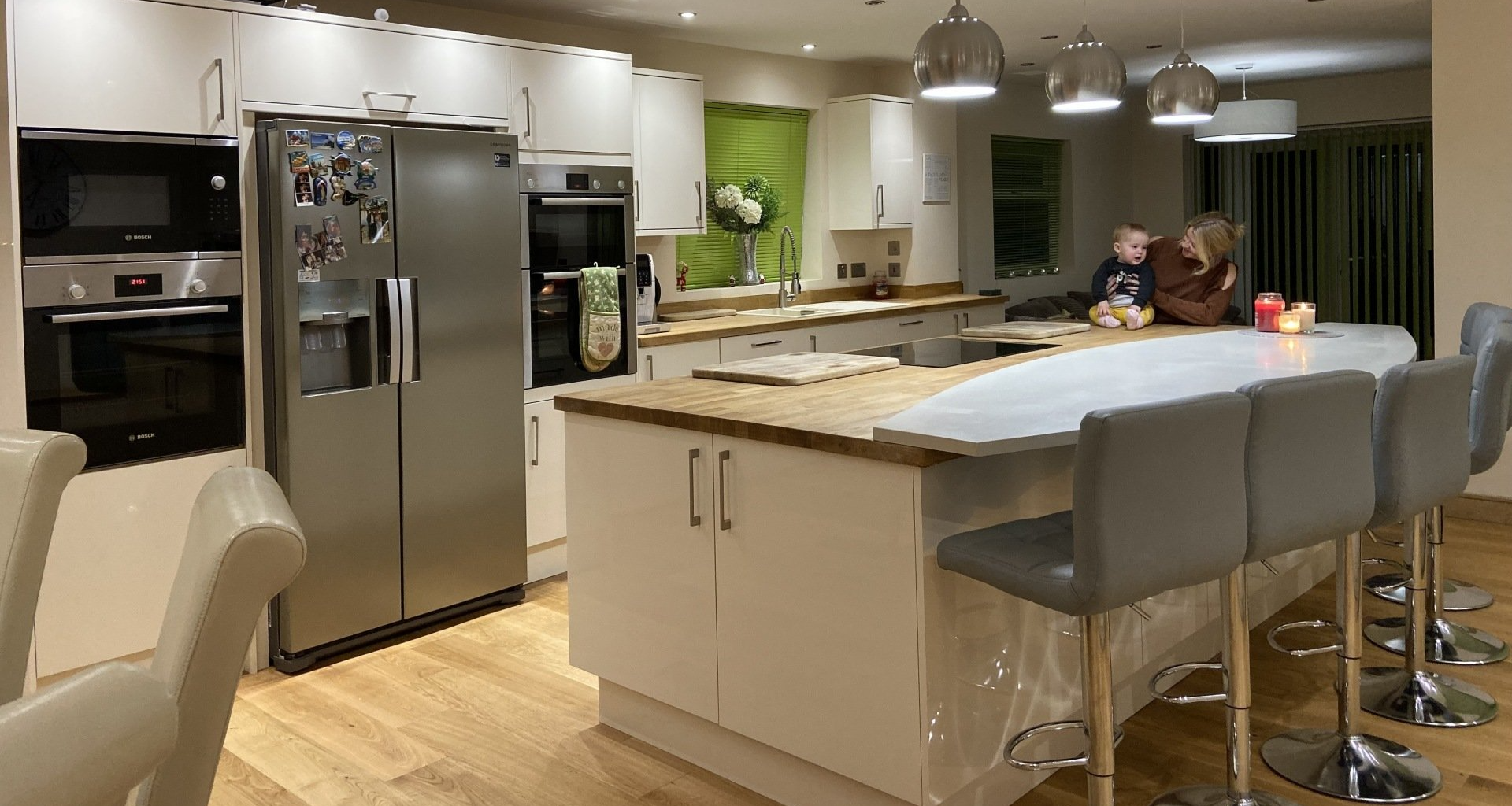 baby and woman enjoying their new modern kitchen design