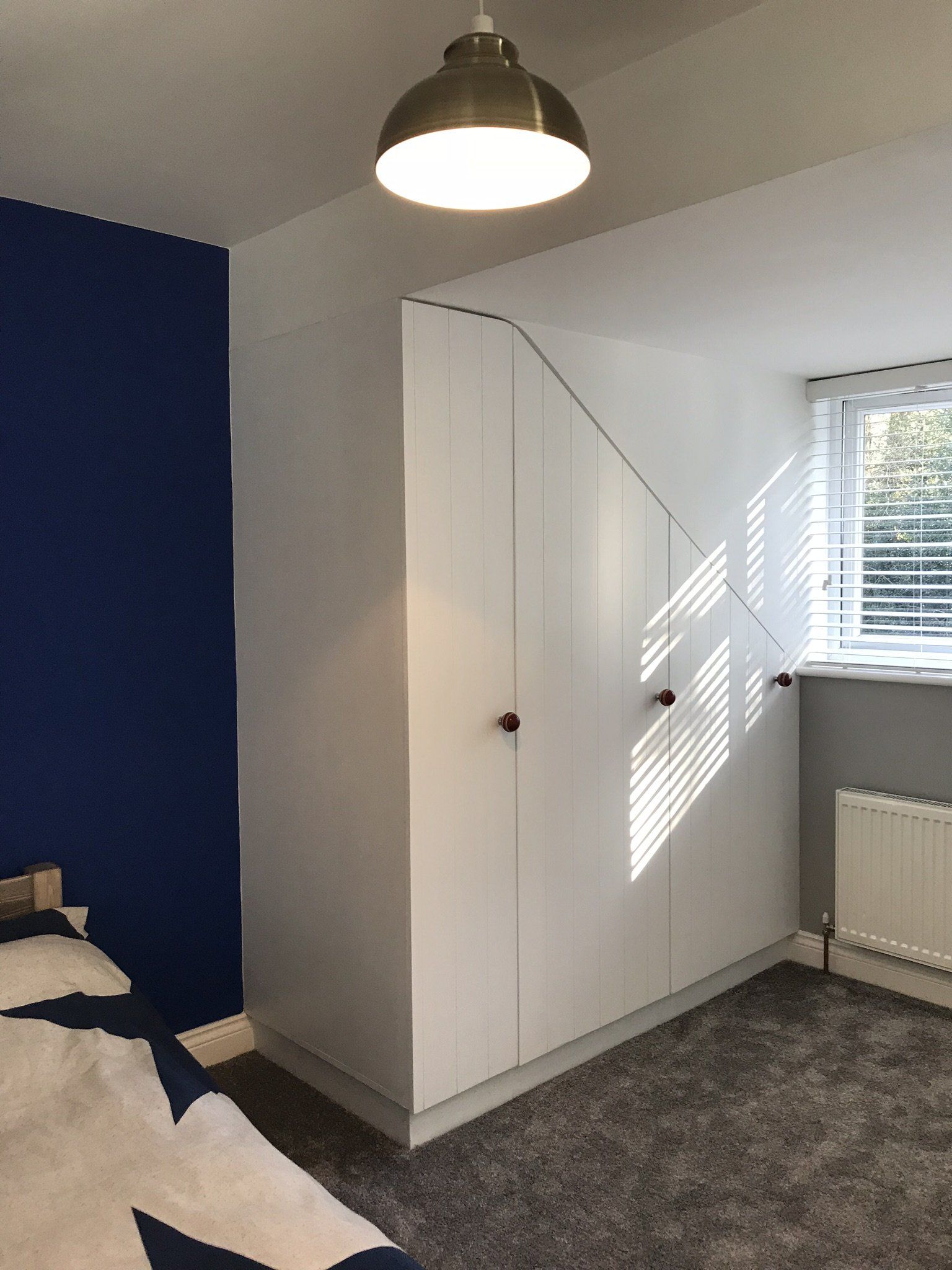Bedroom project with blue feature wall