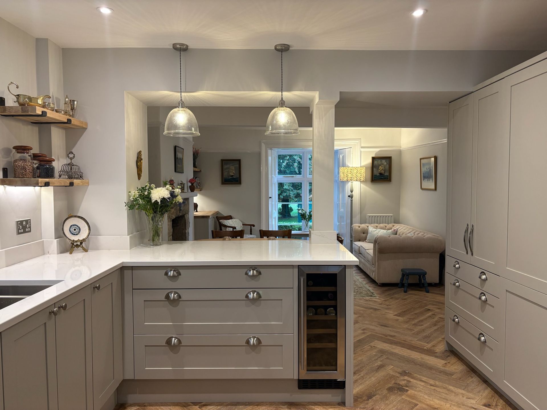 Traditional Shaker style kitchen with cup handles, pendant lights and wine fridge