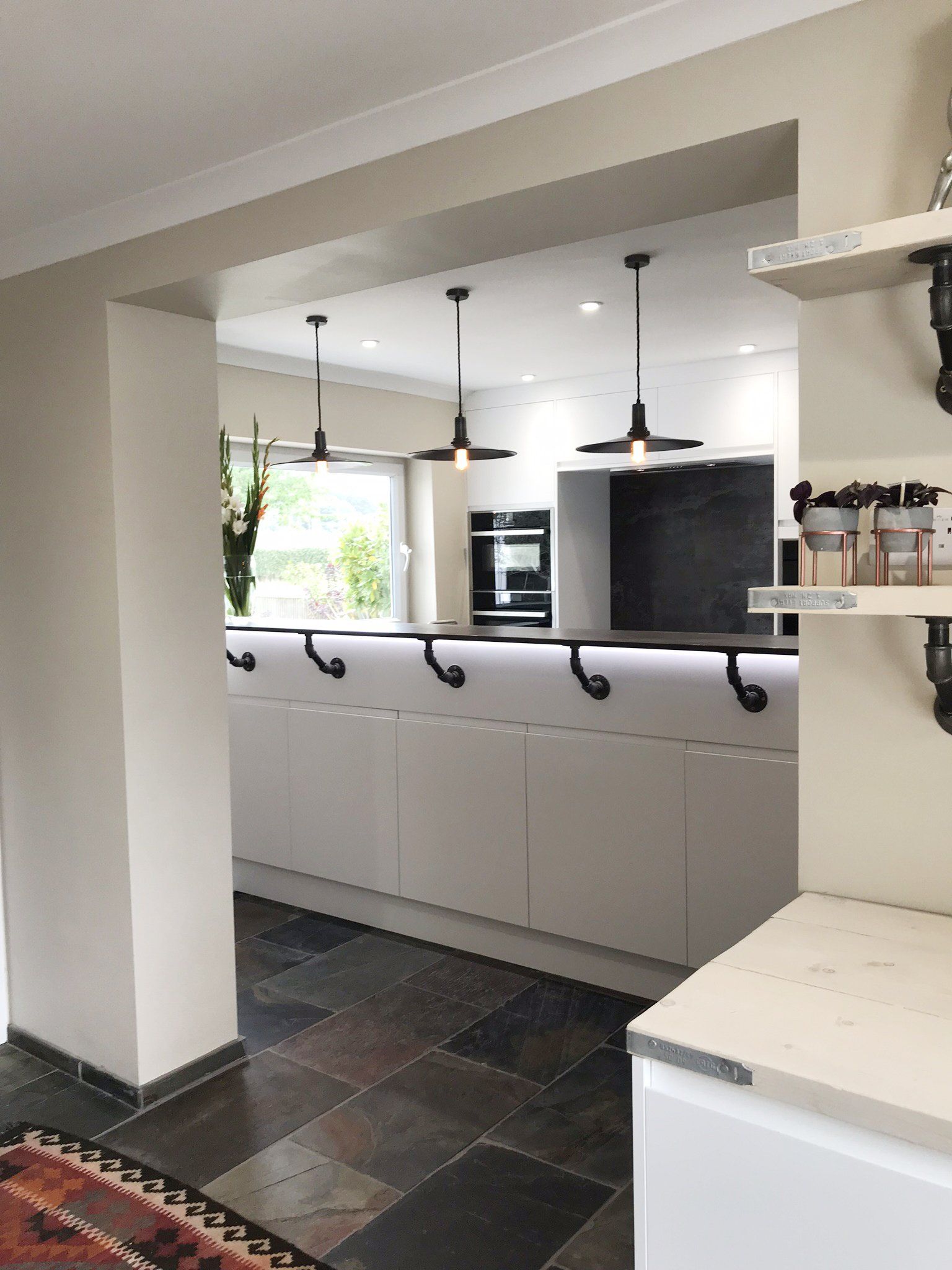 Modern white handless kitchen completed in 2019 in Cold Ash