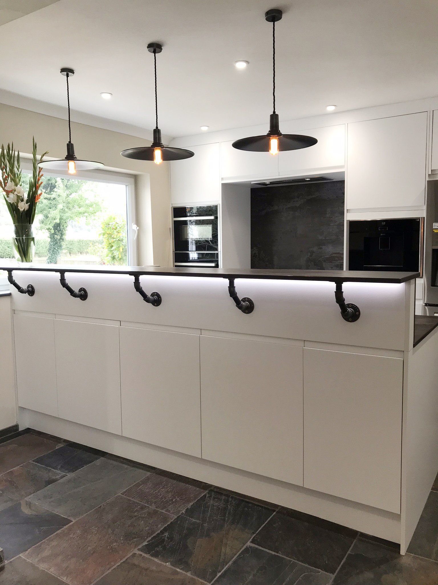 Modern white handless kitchen completed in 2019 in Cold Ash