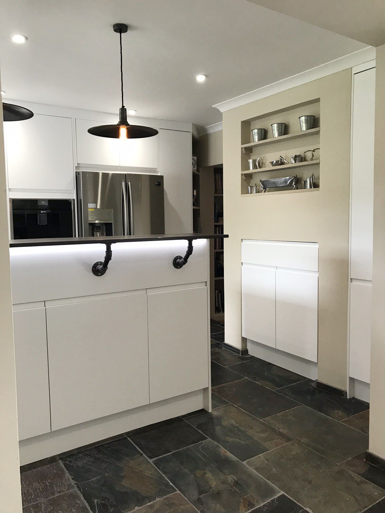 Modern white handless kitchen completed in 2019 in Cold Ash