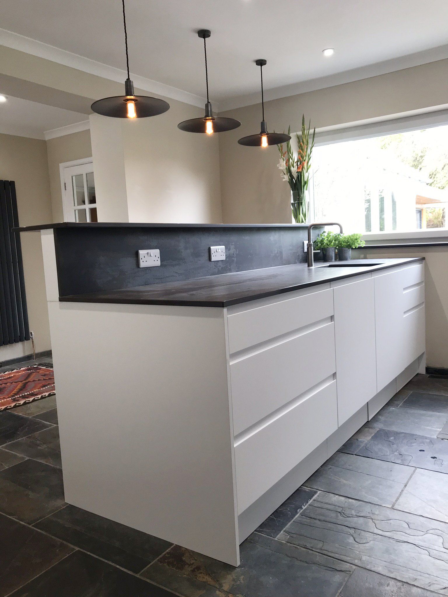 Modern white handless kitchen completed in 2019 in Cold Ash
