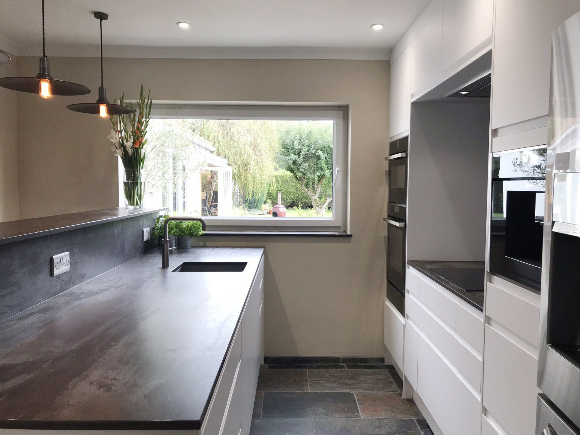 Modern white handless kitchen completed in 2019 in Cold Ash
