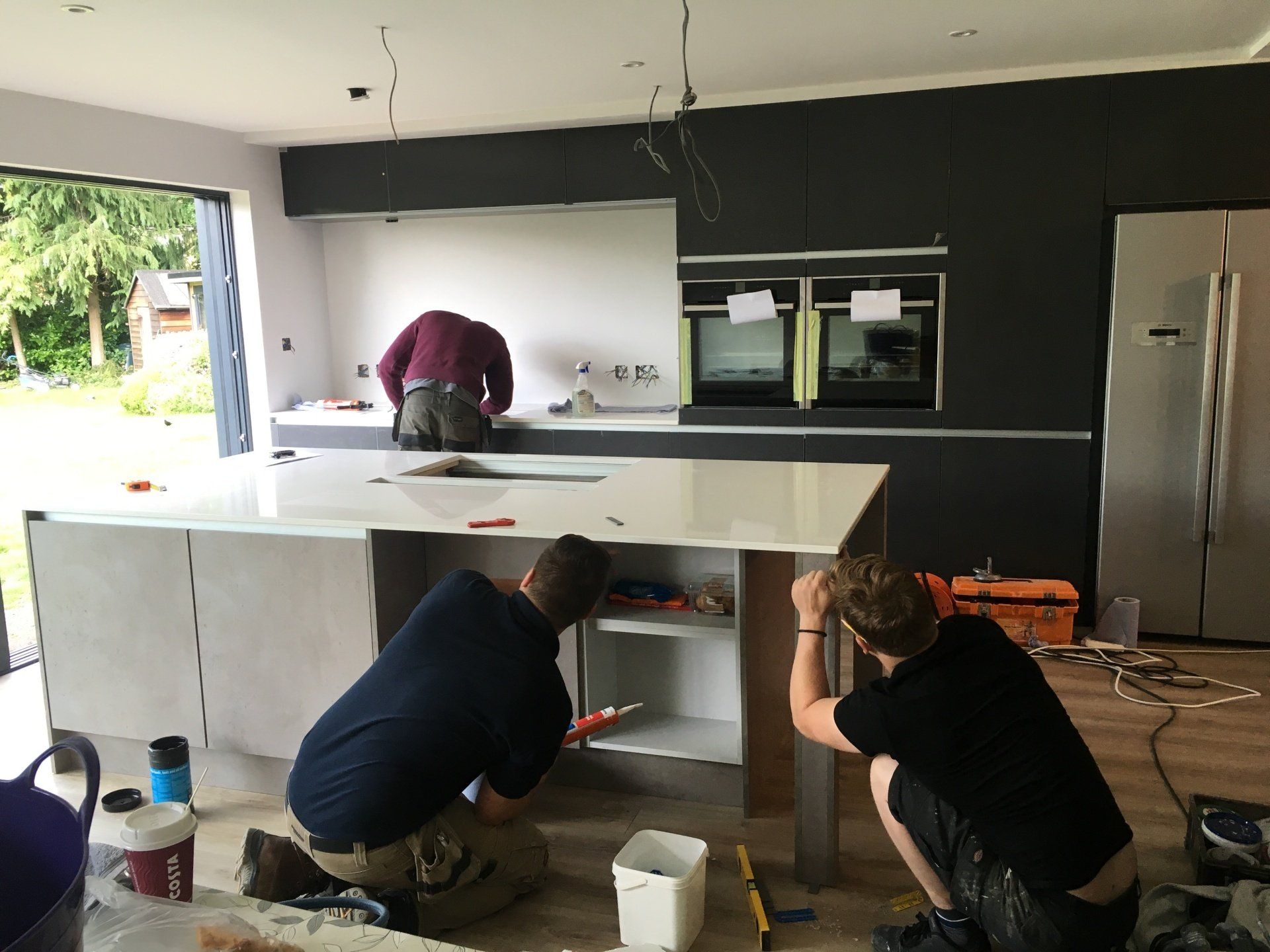 workers installing kitchen island