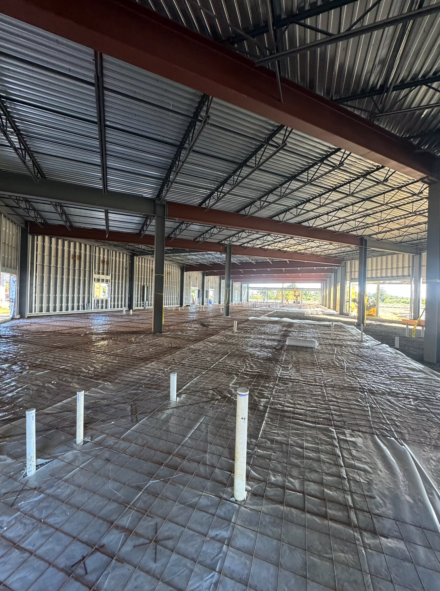 Interior steel structure framing in place during the early stages of commercial building construction.