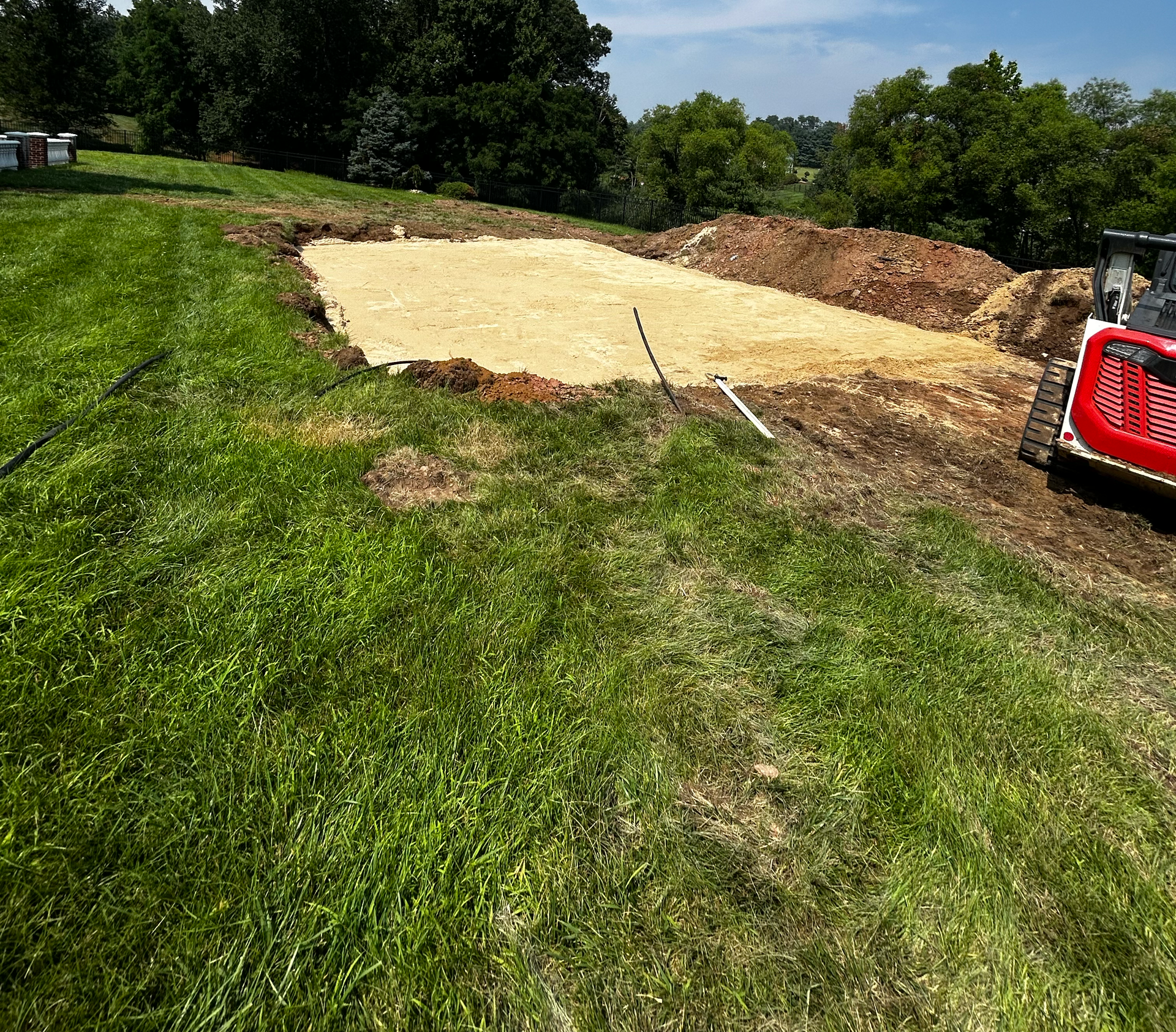 Freshly graded site prepared for future construction or landscaping project.