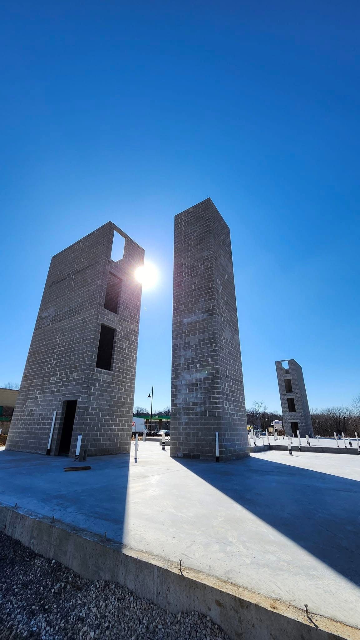Bright blue sky above a construction site, ideal conditions for excavation and utility installation projects.