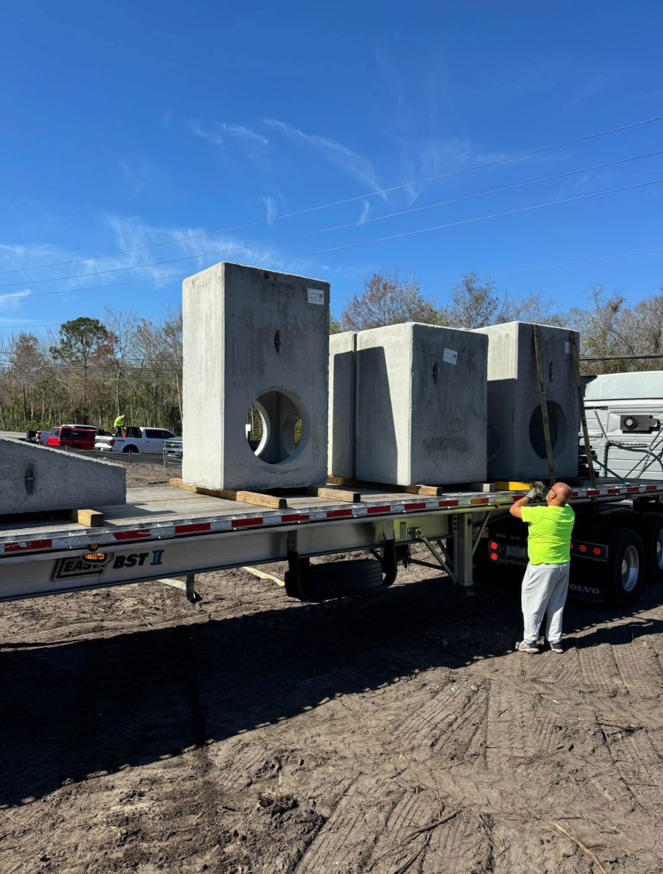 Precast concrete utility vault structures installed on site for stormwater or electrical systems.