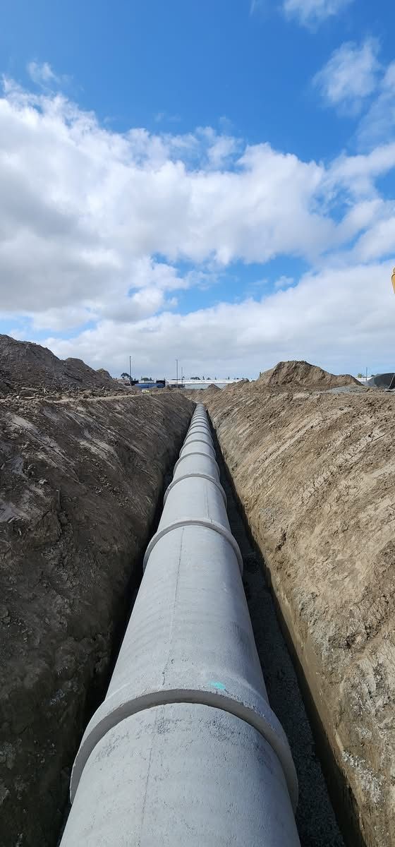 Clear sky above an active construction site, signaling good weather for site development work.
