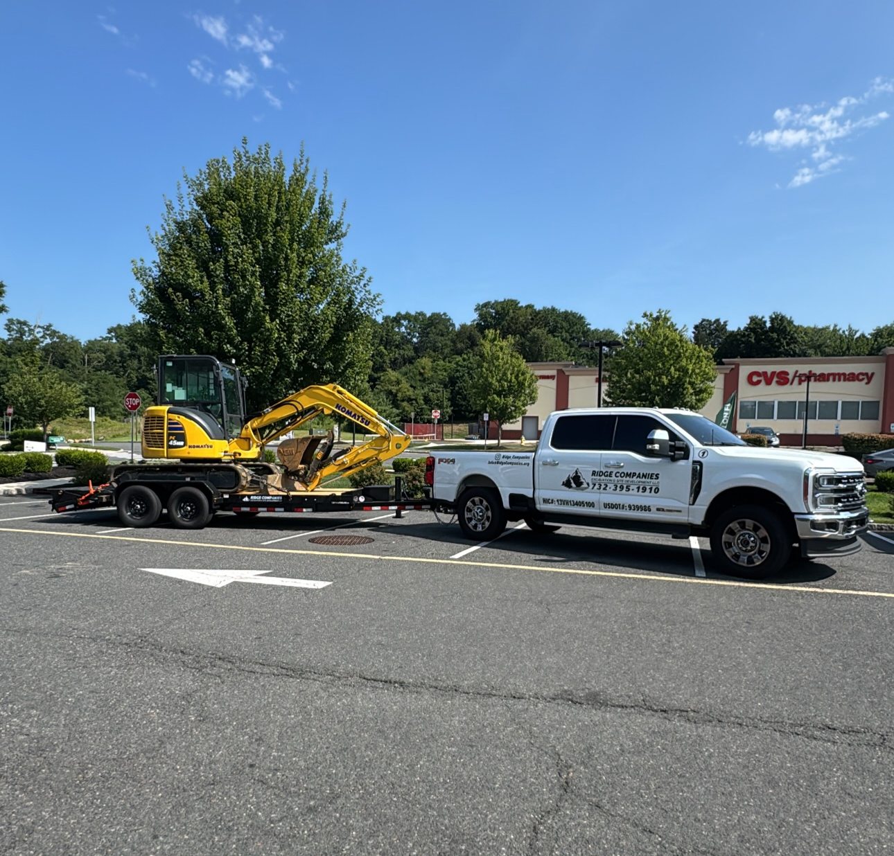 Excavator and service truck ready for deployment to a construction or site development project.