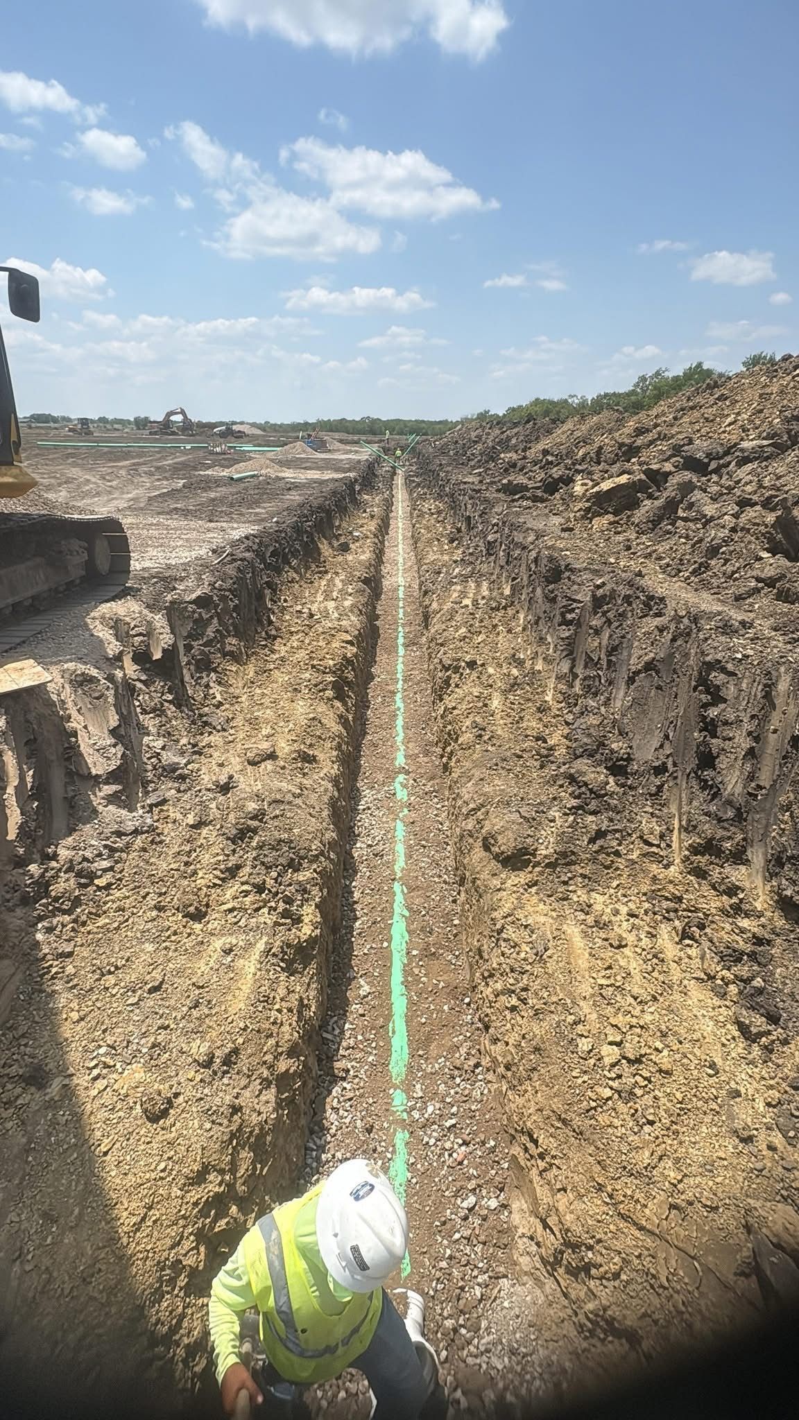 Large excavation site prepared for underground utility installation and infrastructure development.