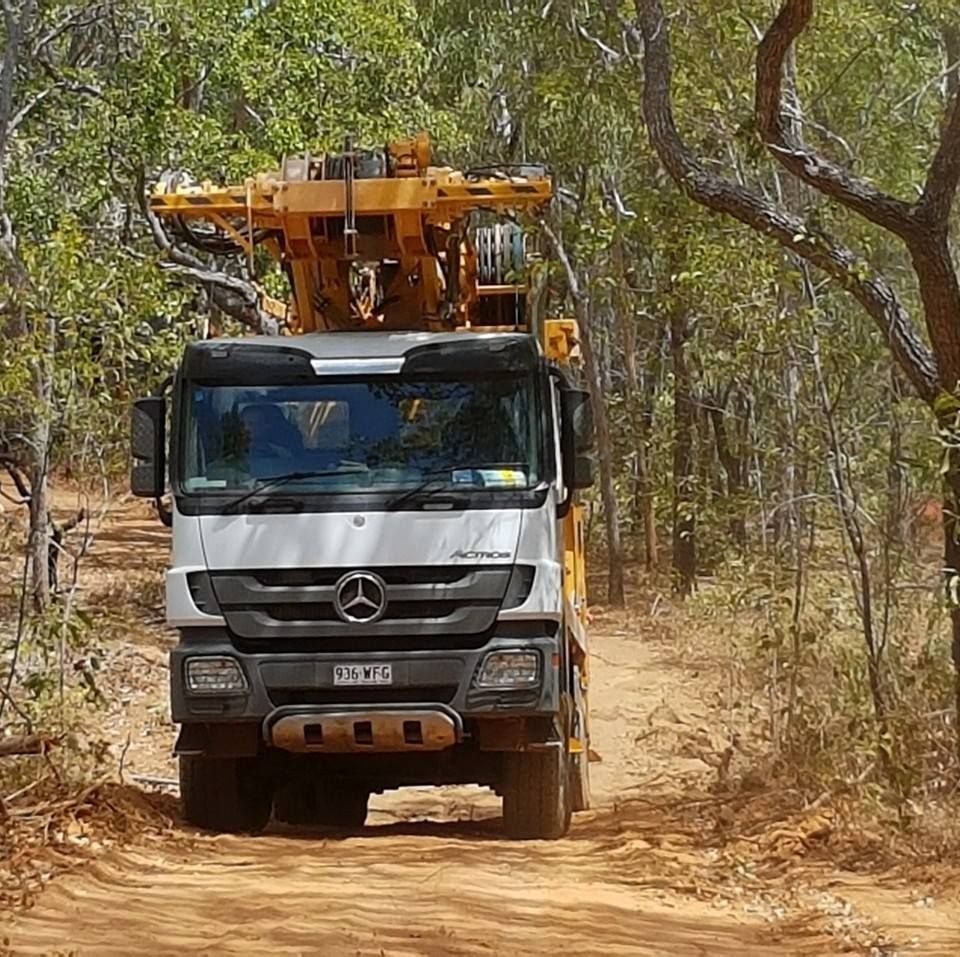 Truck Traveling on a Dusty Trail — Grid Drilling in Maryborough, QLD