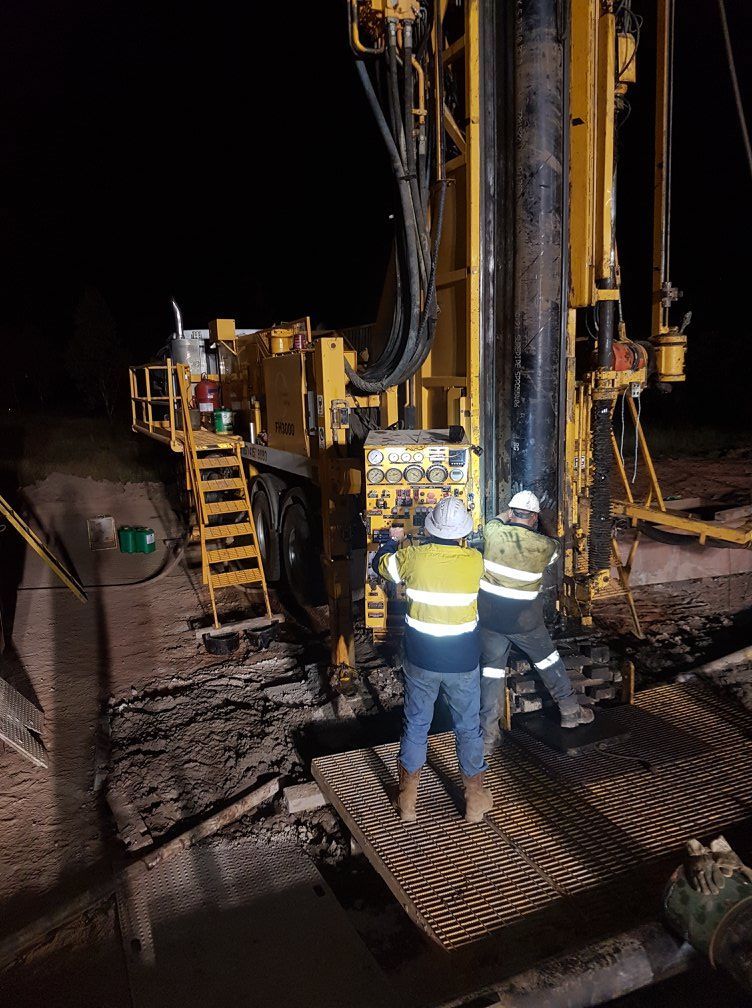Men Working on the Drill Rig During the Night— Grid Drilling in Bundaberg, QLD