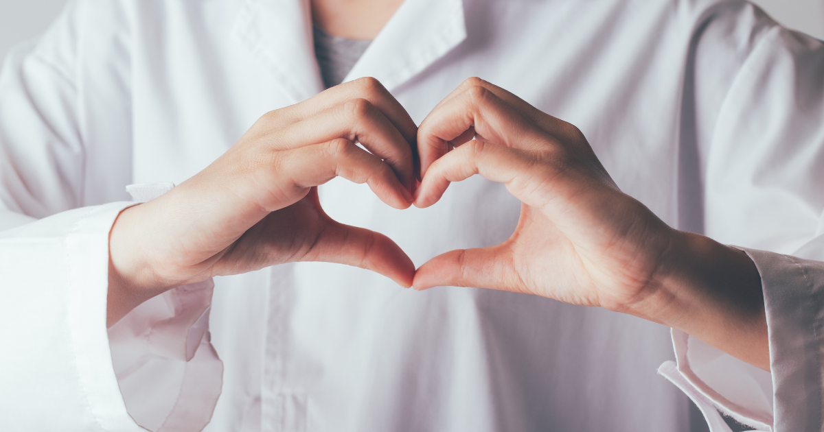 Close-up of doctor forming heart shape, symbolizing compassionate concierge healthcare in Las Vegas