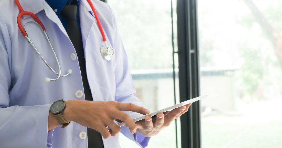Concierge doctor using a digital tablet for patient care coordination in Las Vegas