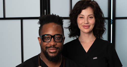 Two healthcare professionals smiling, representing executive physicals and concierge-level personali