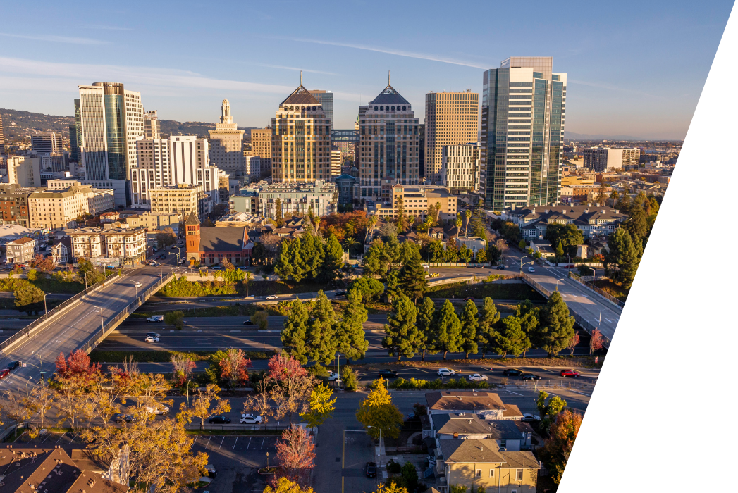 An aerial view of a city with a lot of buildings and trees in San Jose California.