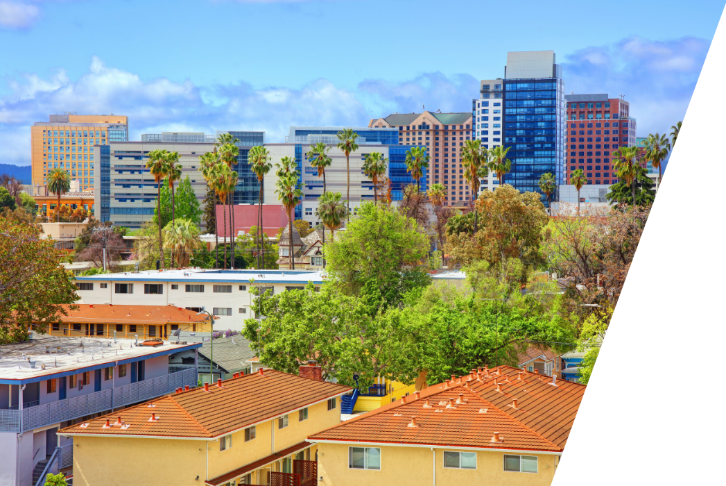 An aerial view of a city with a lot of buildings and trees in San Jose California.