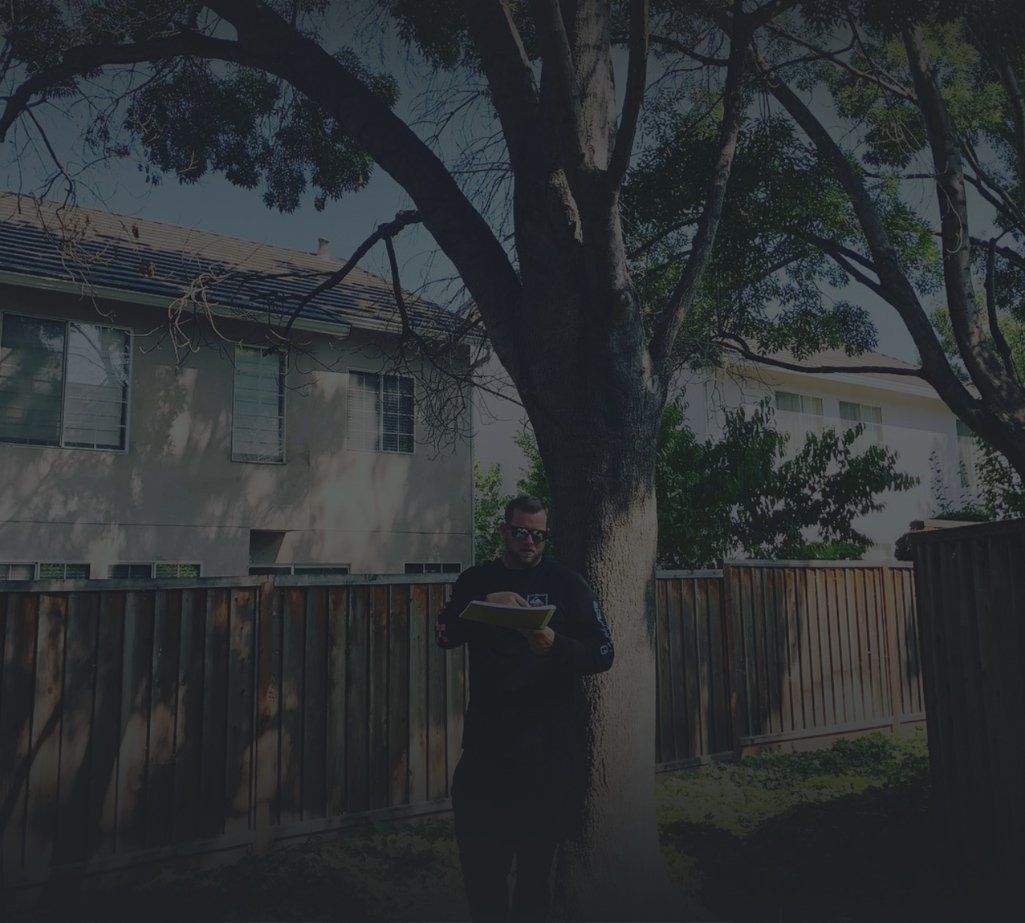 Michael Waller holding a clipboard as he inspects a residential space