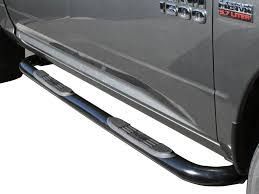 A close up of a truck's side step on a parking lot.