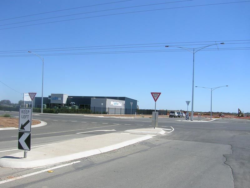 An Intersection with a Sign that says keep left — Mawson Constructions in Kialla, VIC