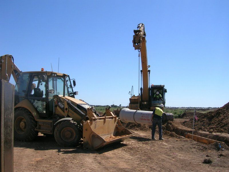 Construction Site with a Bulldozer and a Crane — Mawson Constructions in Kialla, VIC