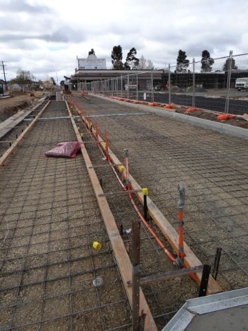 A Concrete road is being built on a Cloudy day — Mawson Constructions in Kialla, VIC