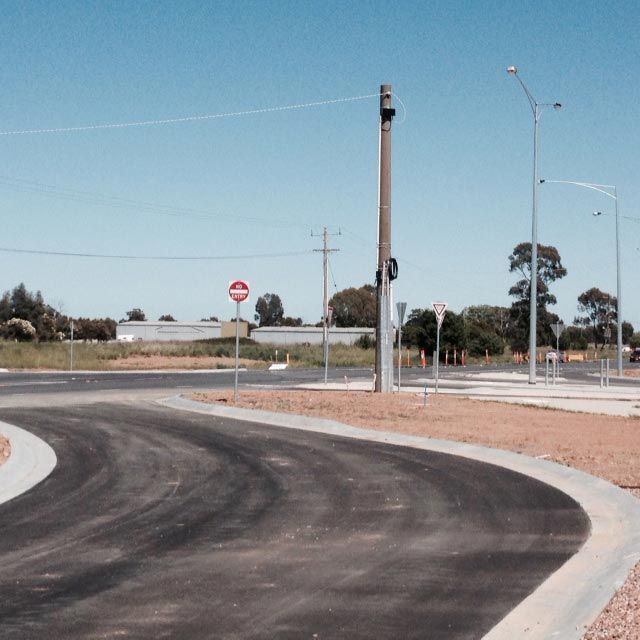 A Road with a Stop sign on it — Mawson Constructions in Kialla, VIC