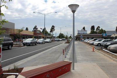 A Row of cars are Parked on the side of the road in a Parking lot — Mawson Constructions in Kialla, VIC