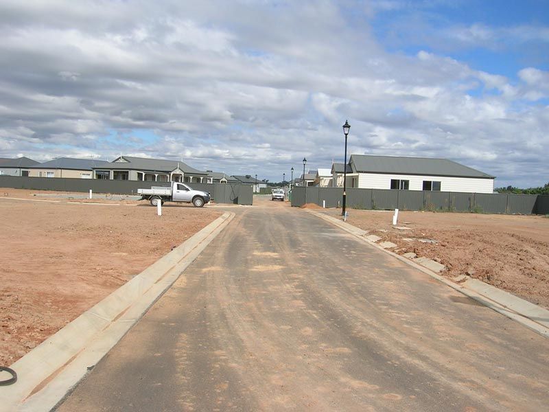 A White truck is Parked on the side of a dirt road — Mawson Constructions in Kialla, VIC