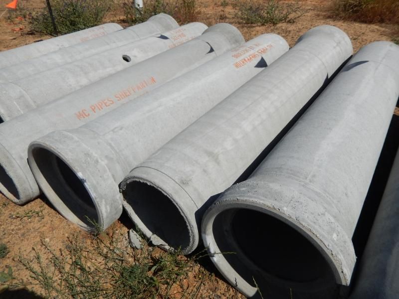 A Bunch of Concrete Pipes are Stacked on Top of each other — Mawson Constructions in Kialla, VIC