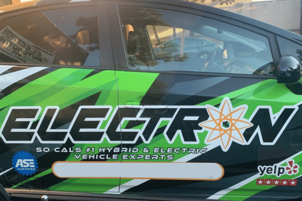 Electric vehicle service car with Electron Automotive branding