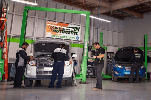 Electron Automotive team working on vehicles in service bay