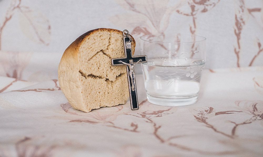 bread water and a crucifix