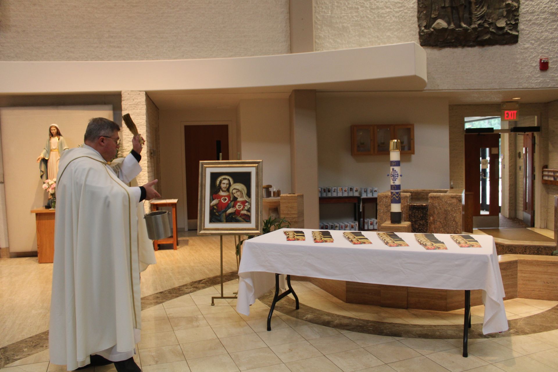 Priest blessing consecration materials