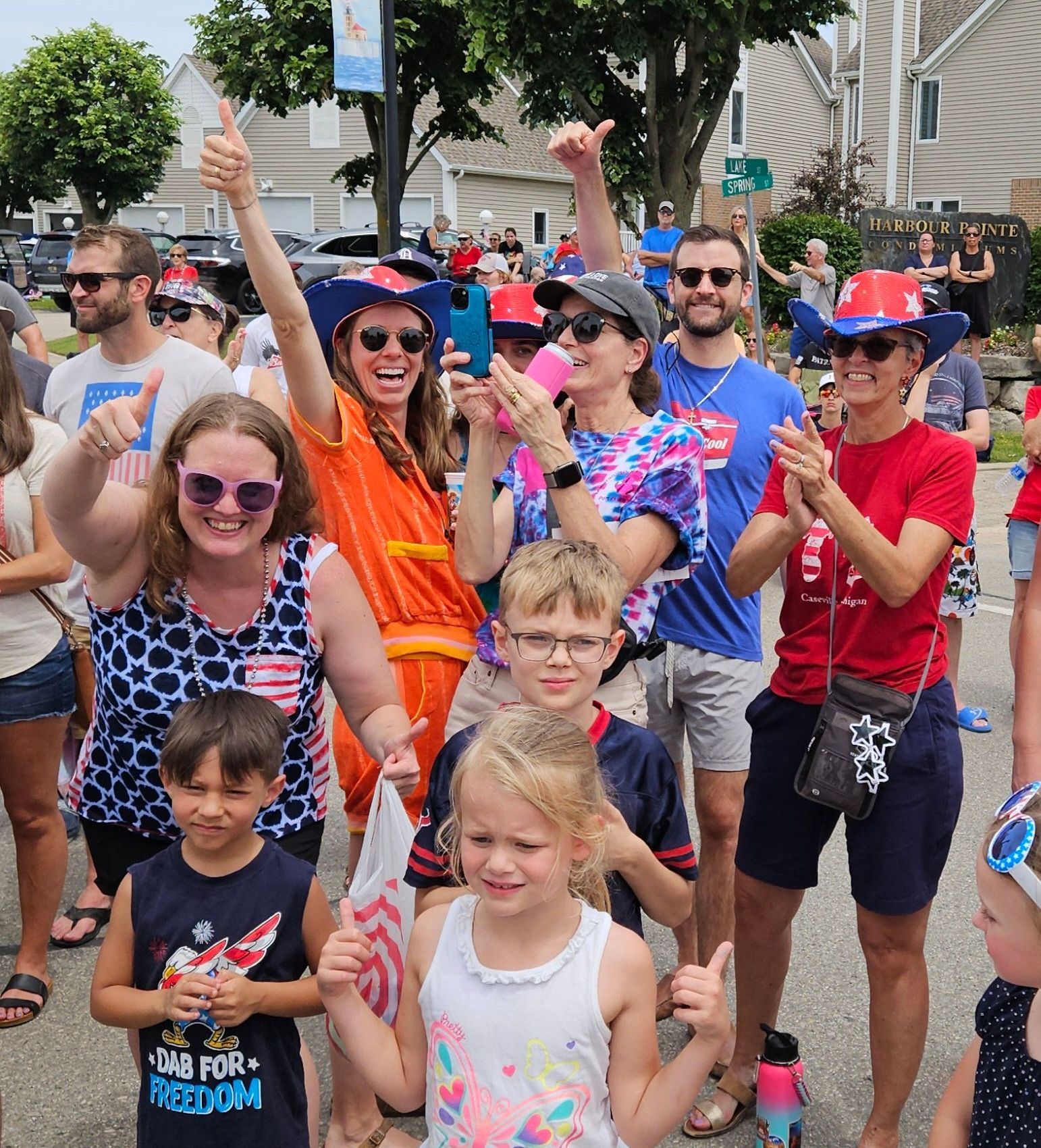 A group of people are posing for a picture at the cheeseburger fest