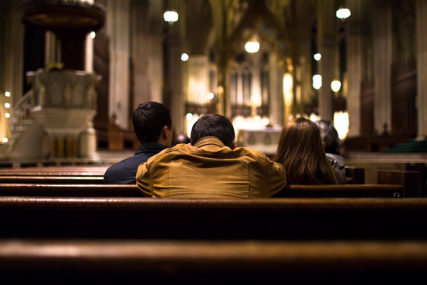 people praying after Mass