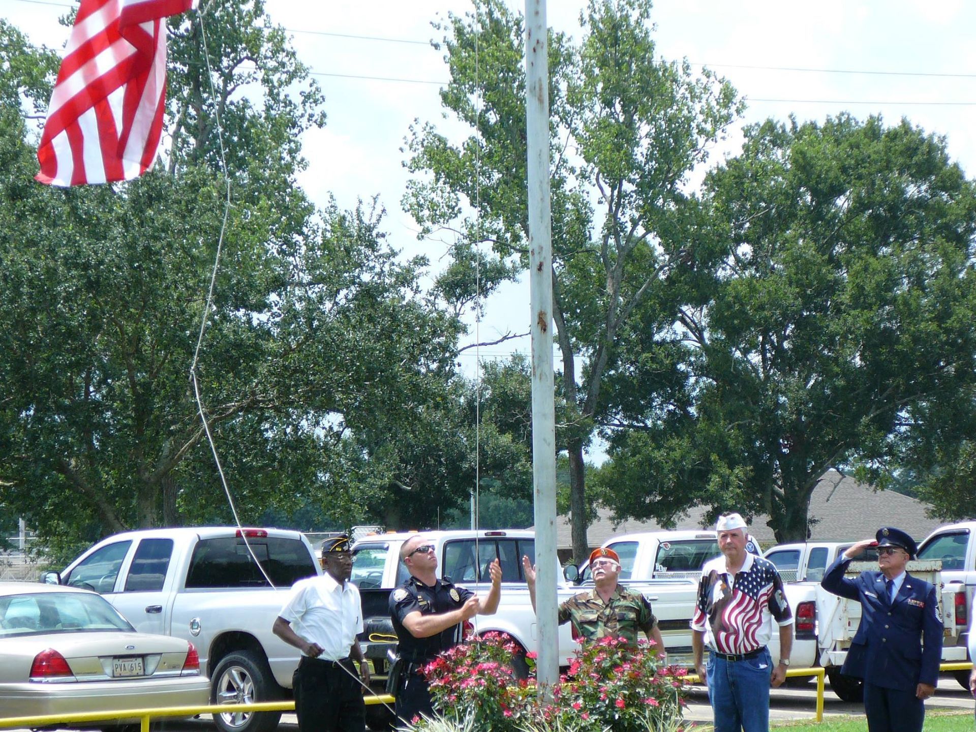 A group of people standing in front of an american flag