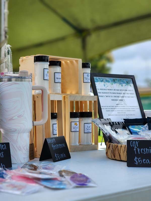 A table with a lot of items on it and a sign that says ' soap ' on it.
