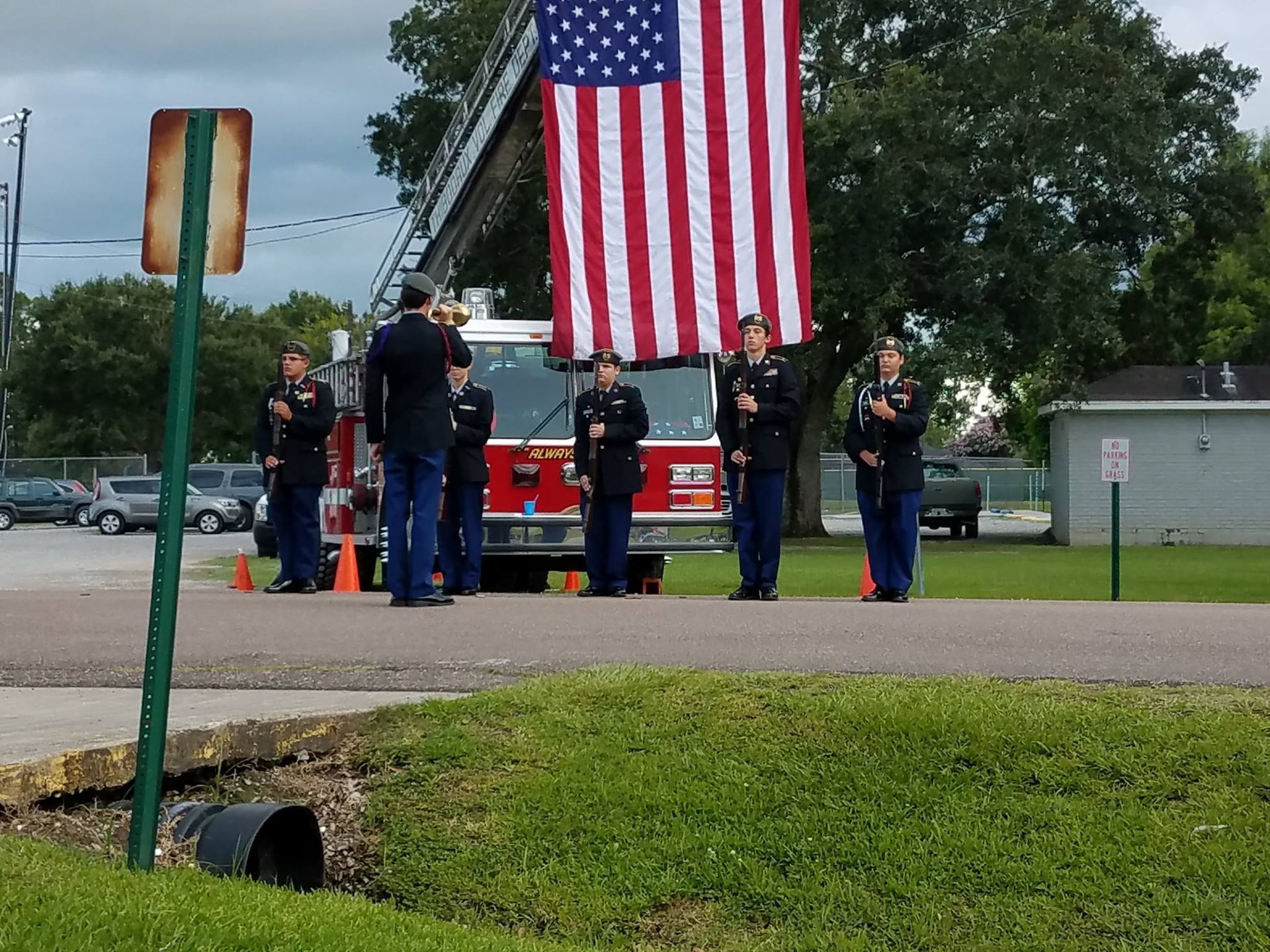A group of people standing in front of an american flag